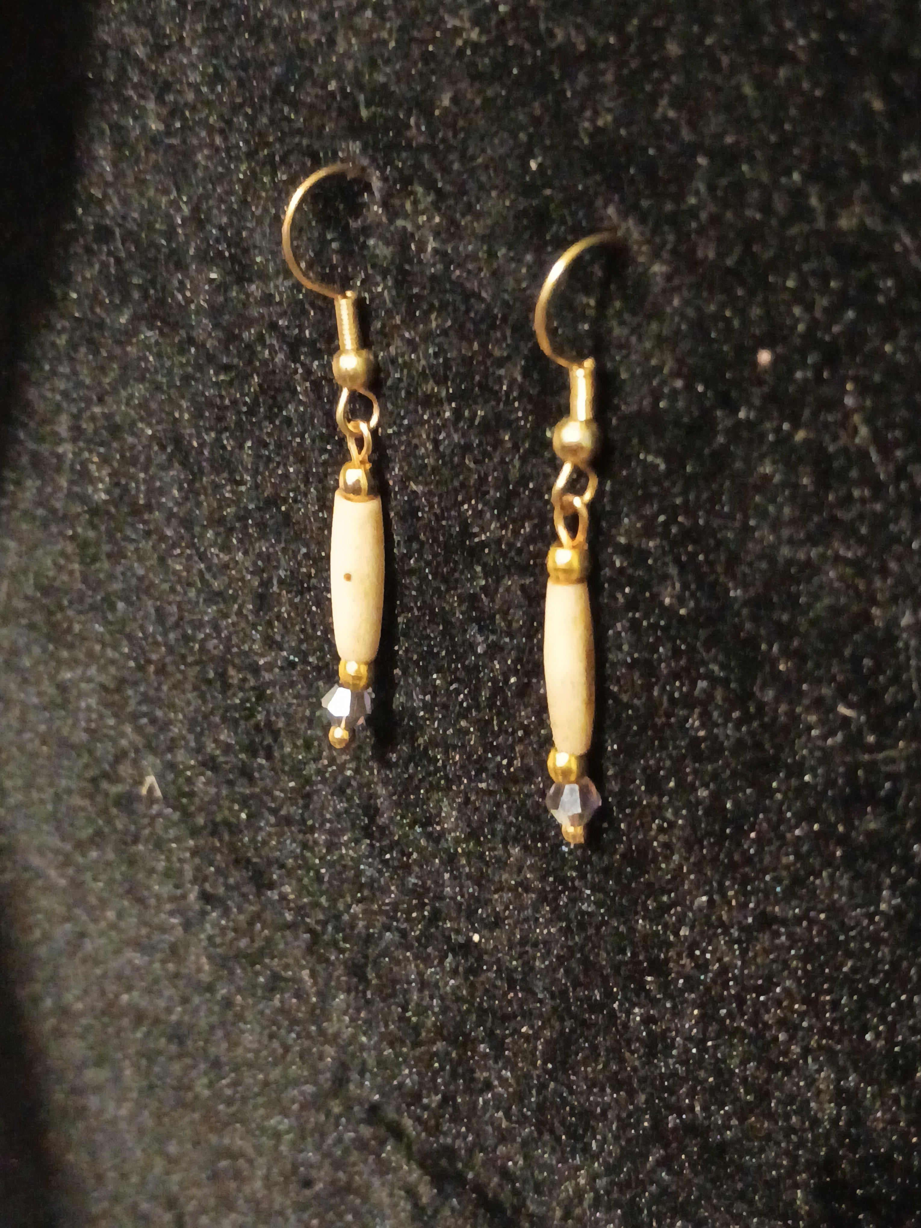 Gold with 1/2 inch tea stained Hairpipe and AB purple crystal earring